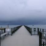 An ominous sky and a long dock at Lake Tahoe.